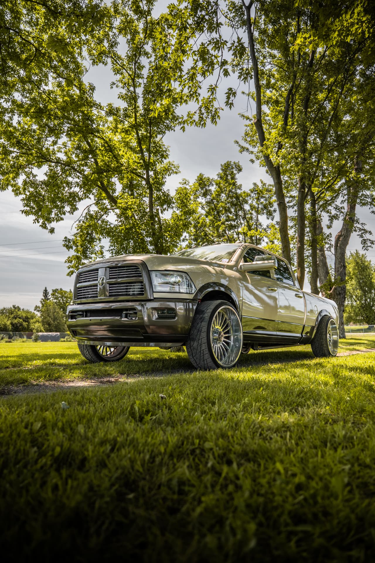 Front three-quarter view of the custom Ram with polished forged wheels